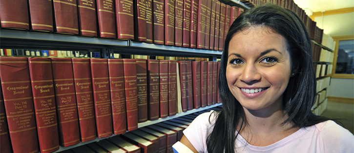 young woman with dark hair similing